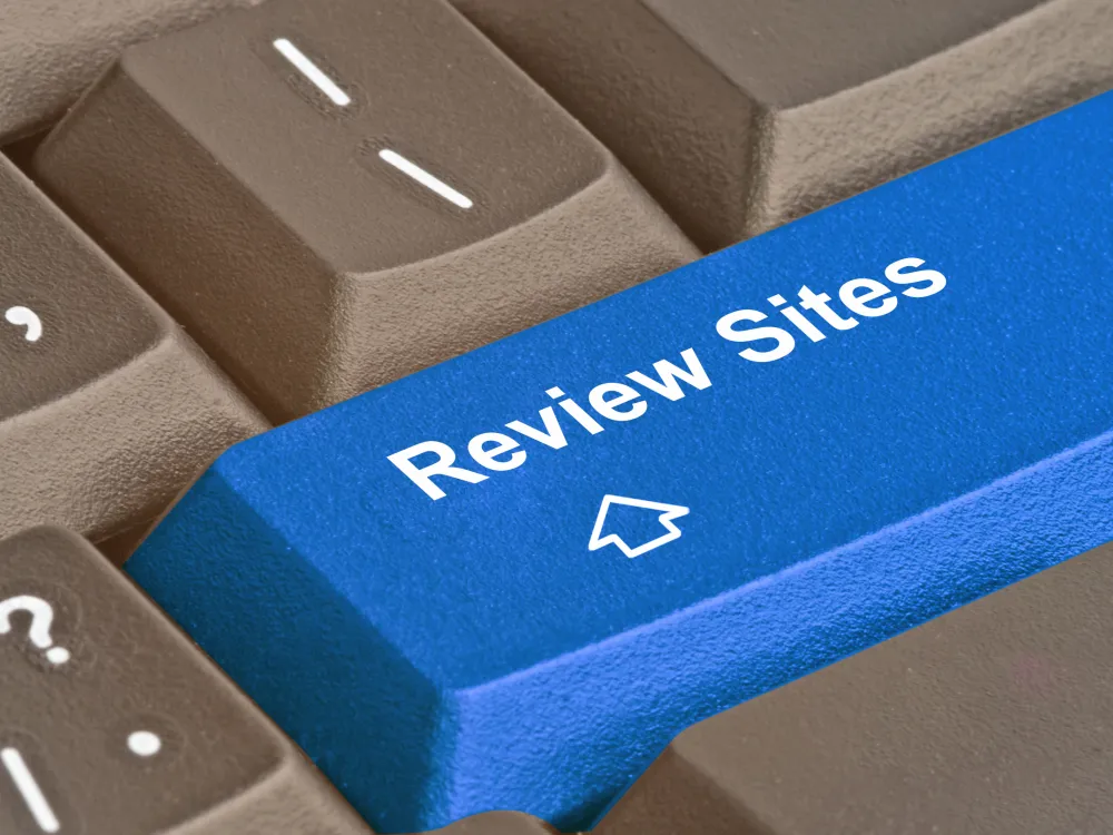 The Economics of Legitimate Review Sites: Reducing Information Asymmetry in the Digital Marketplace